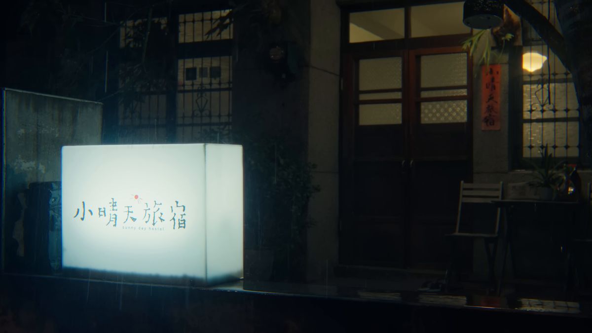 夜に灯る宿の白い看板
