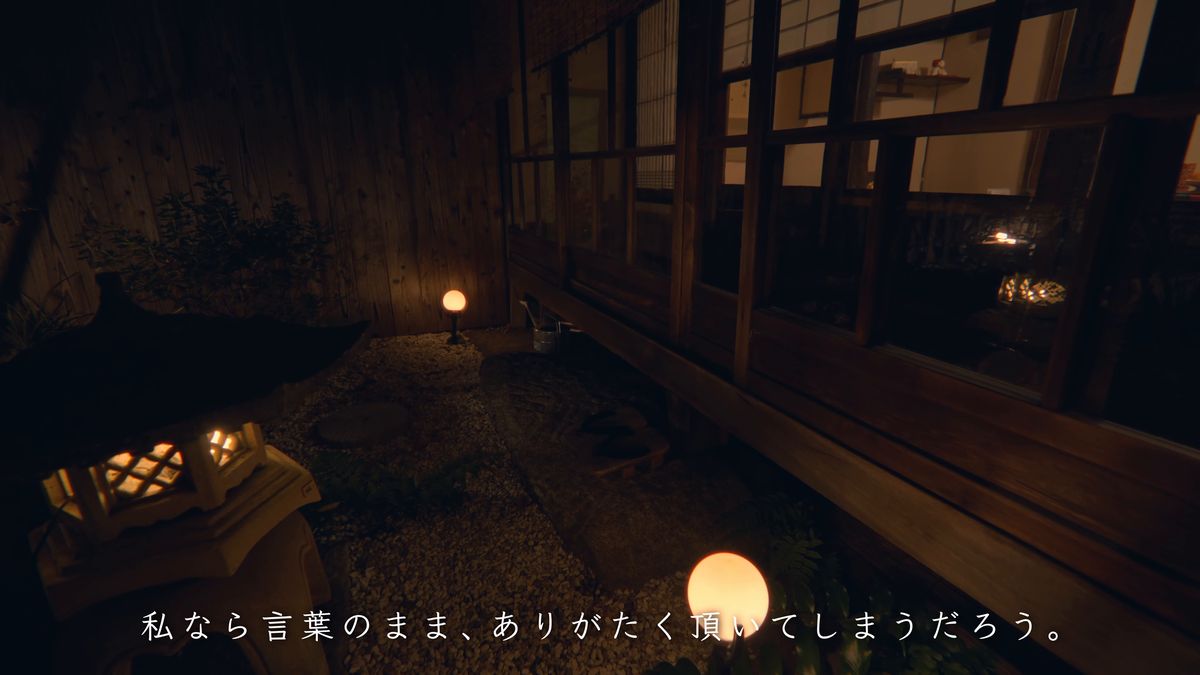 石灯籠と小さな灯りのある夜の坪庭