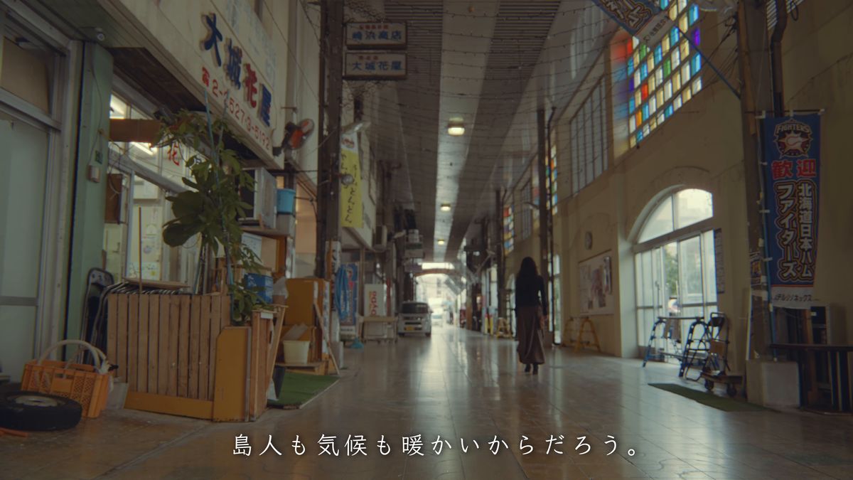 An arcade walkway with stained-glass windows