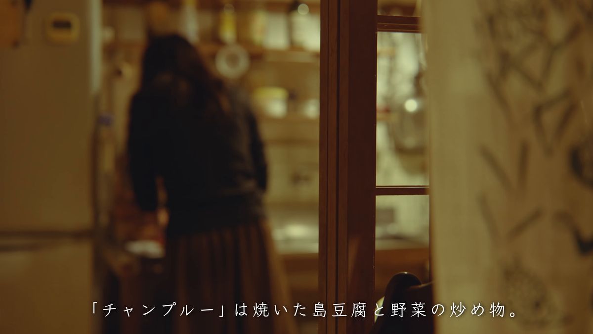 Standing in the kitchen at night