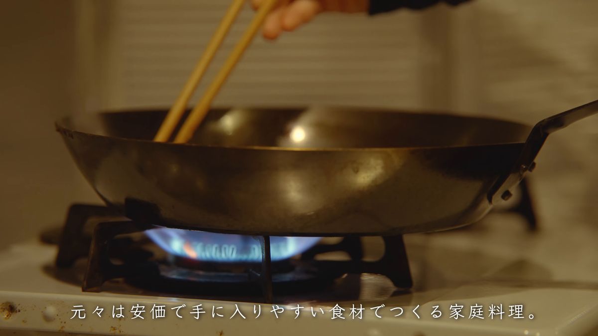 An iron frying pan over the flame