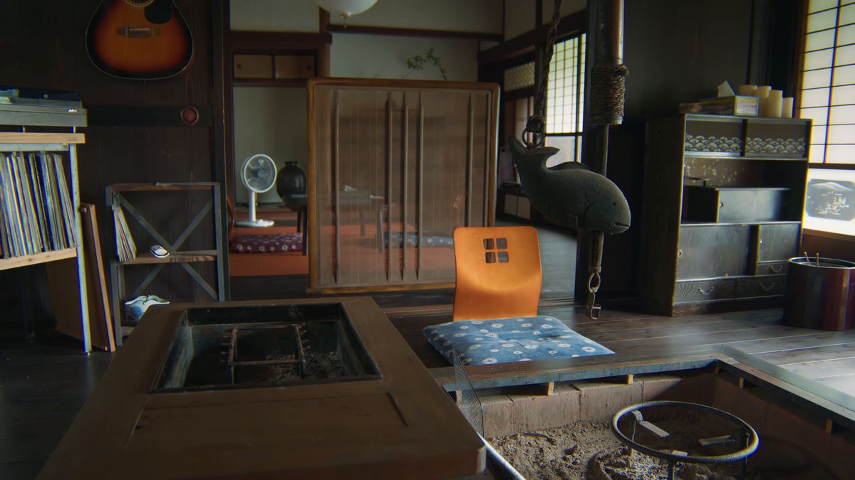 ギターとレコード棚のある囲炉裏の間
